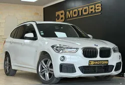 Garantie 12 mois BMW X1 II (F48) sDrive18iA 140 ch M Sport DKG7 / Full suivi BMW / Pack M / Toit ouvrant / Sièges électriques à mémoire / Climatisation automatique bi-zones / Caméra de recul /
